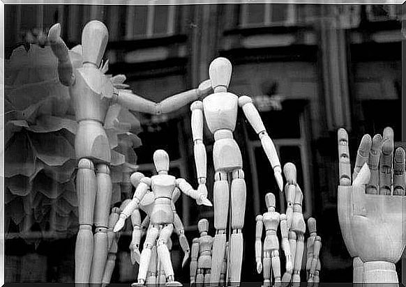 Wooden dolls in black and white