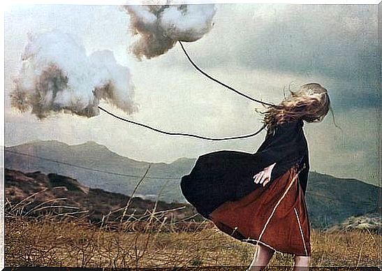 Woman walking with clouds on a leash