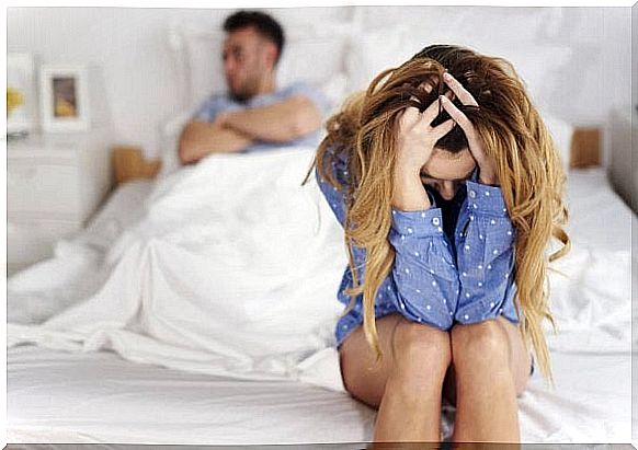 Frustrated couple in bed