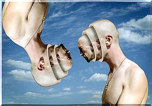 Two people with several faces in front of sky