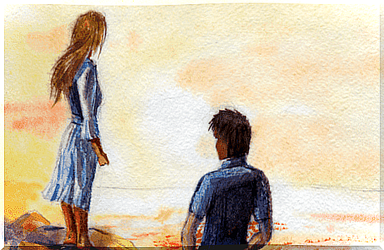 A couple on the beach, which is a symbol of using emotional intelligence in relationships