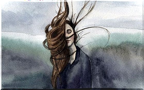 a woman whose hair blows in the wind