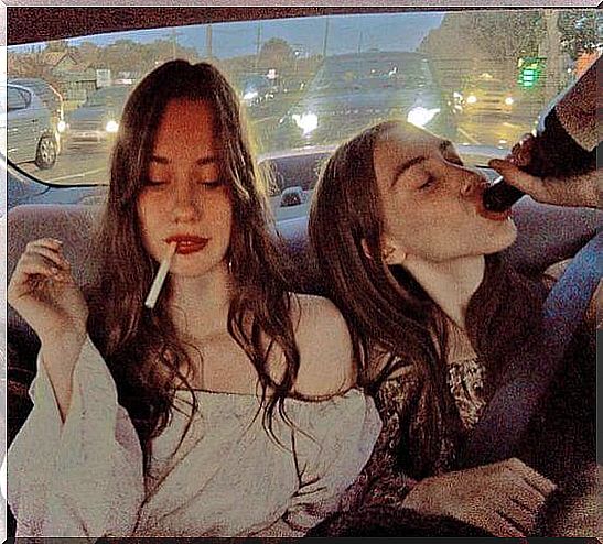 Girls in cars drink and smoke