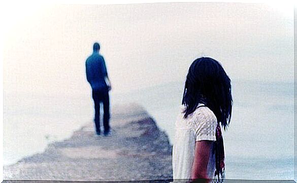 Couple on bridge where boy tries to say "I no longer love you"