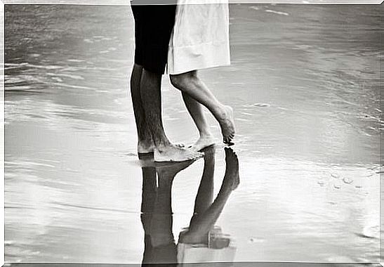 Couple dancing together on the beach