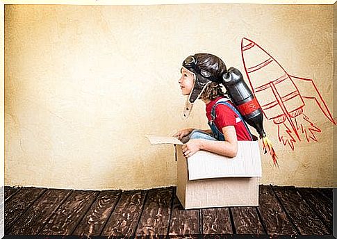 Boy plays pilot in a box that shows it's good to be bored