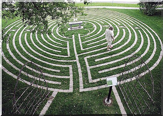 Person is meditating in maze