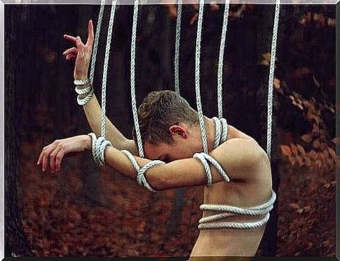 Man tied tightly to rope