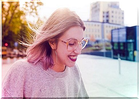 Happy girl with glasses laughing