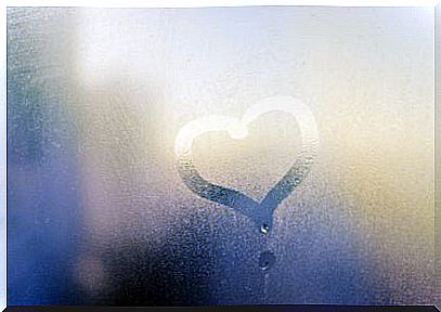 a heart drawn in the dew on the pane