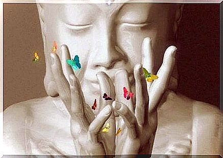 Buddha statue with small butterflies