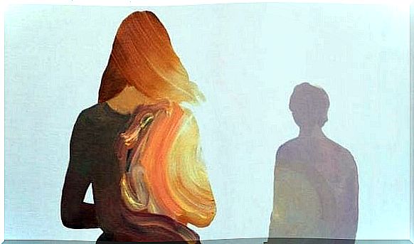 Silhouette of woman in front of man