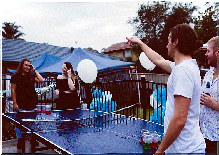 People play table tennis