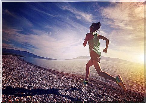 Woman running by sea