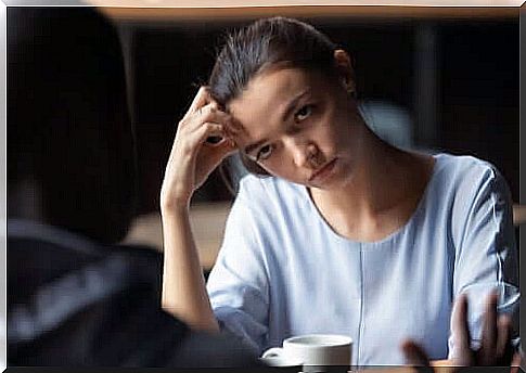 Woman getting bored during conversation