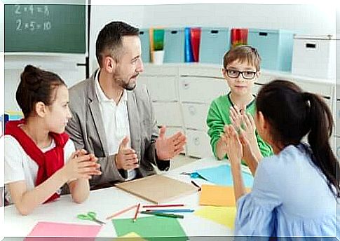 Male teacher with children